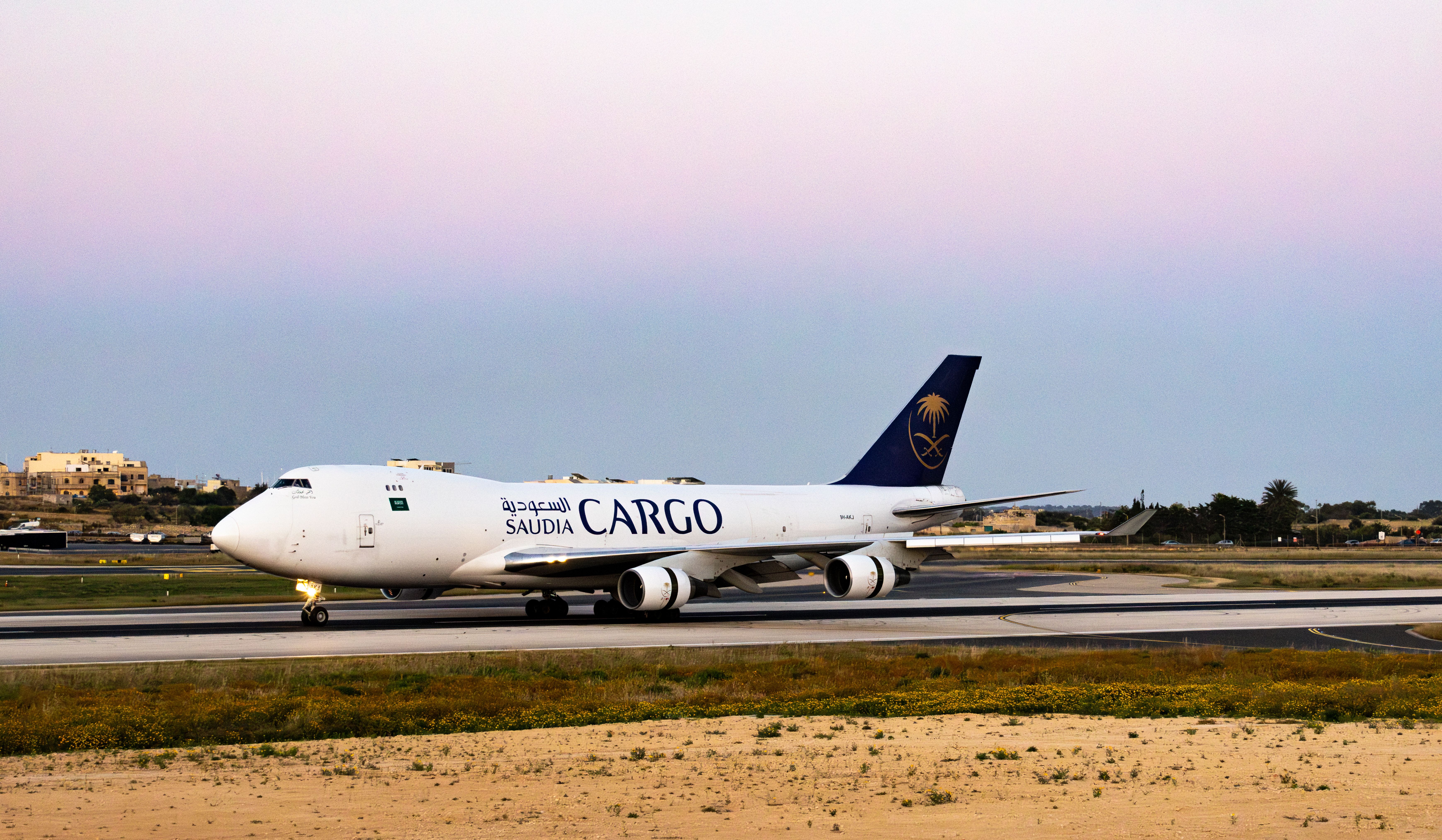 Cargo aircraft being loaded on the tarmac
